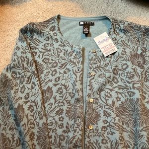 Woman’s blue and grey cardigan